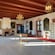A grand room decorated with antique furniture, paintings and chandeliers